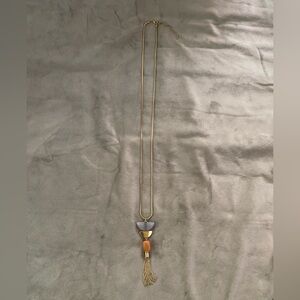 Long gold chain with pendant
